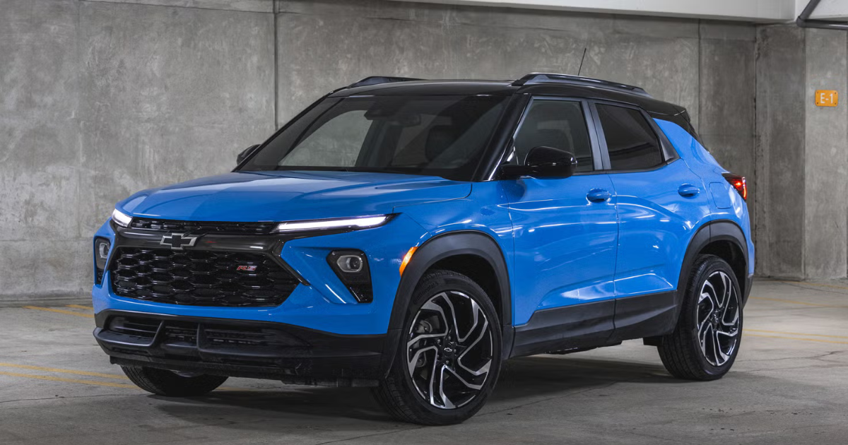A blue 2024 chevy trailblazer in a parking garage with a gray concrete background