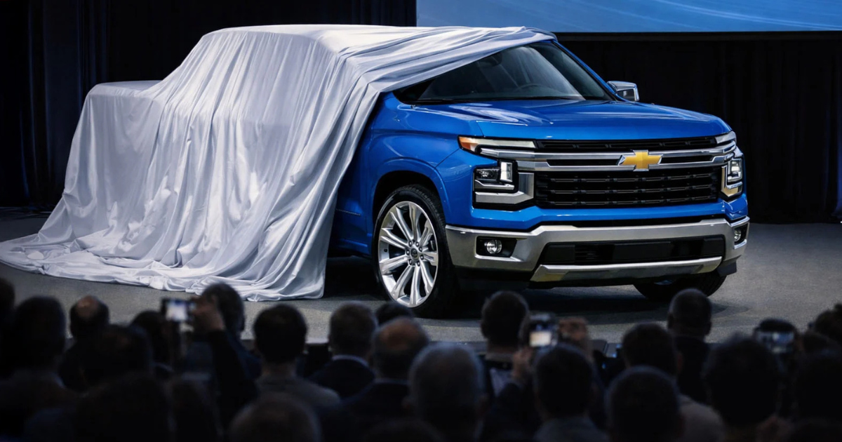 the unveiling of a blue 2027 Chevy Silverado in front of a crowd