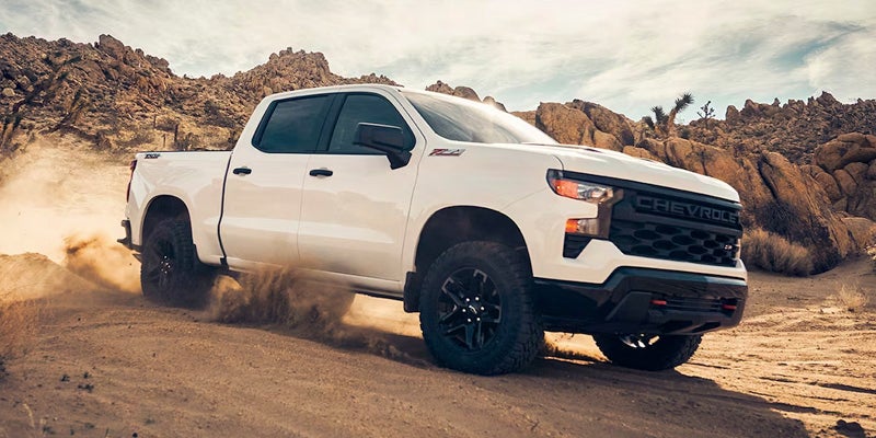 The 2024 Chevrolet Silverado on a mountain road