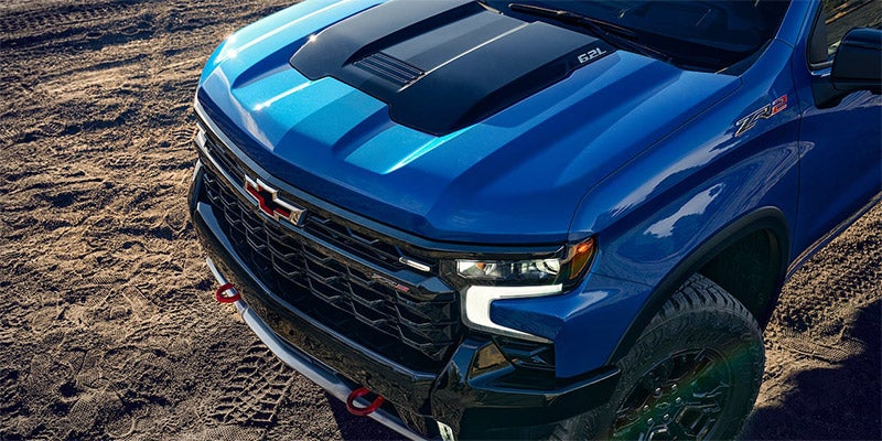 The 2024 Chevrolet Silverado in a striking blue hue, highlighting its robust build and contemporary styling.